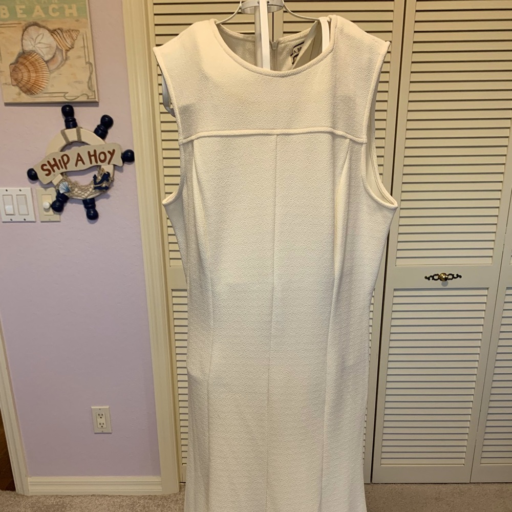 This cream colored dress is just the perfect dress to be paired with a jacket